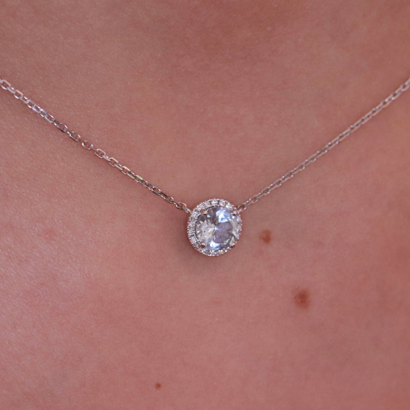 18K white gold round topaz and diamond halo necklace