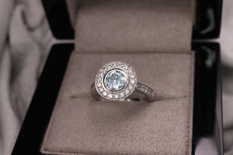 Round Aquamarine and Diamond Halo Ring